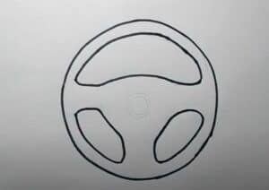 A drawing tutorial showing step-by-step instructions on how to draw a steering wheel for beginners.
