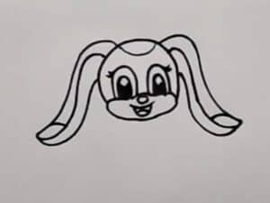 A cute cartoon puppy face drawing with big expressive eyes and floppy ears, perfect for beginners learning to draw step by step.