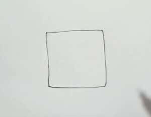 A simple hand-drawn square sketch on white paper illustrating the initial step in a step-by-step drawing tutorial.